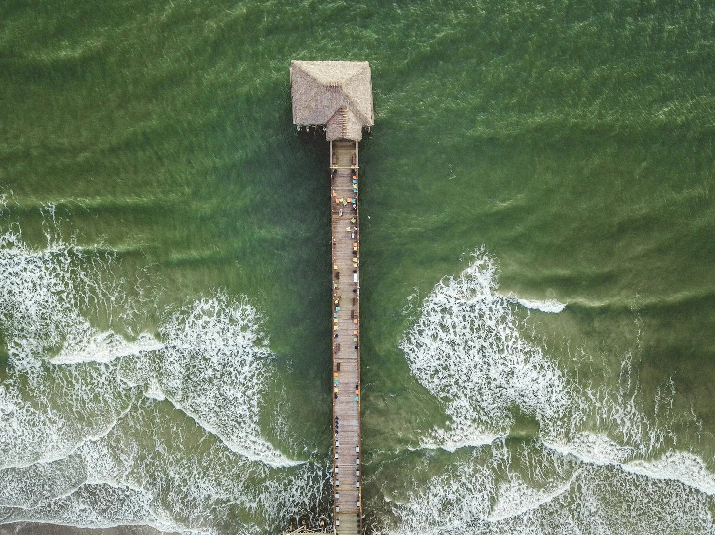 Aerial view of Cocoa Beach Pier over the Atlantic Ocean